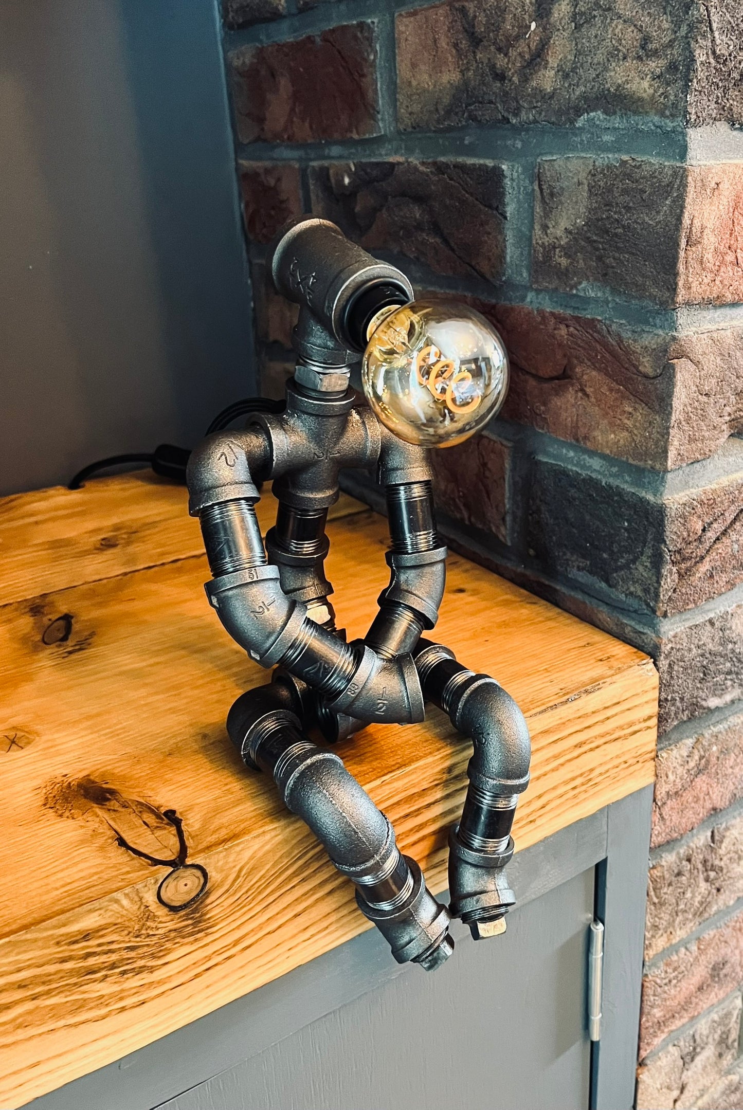 The Pensive Man Industrial Iron Pipe Lamp & Vintage Bulb