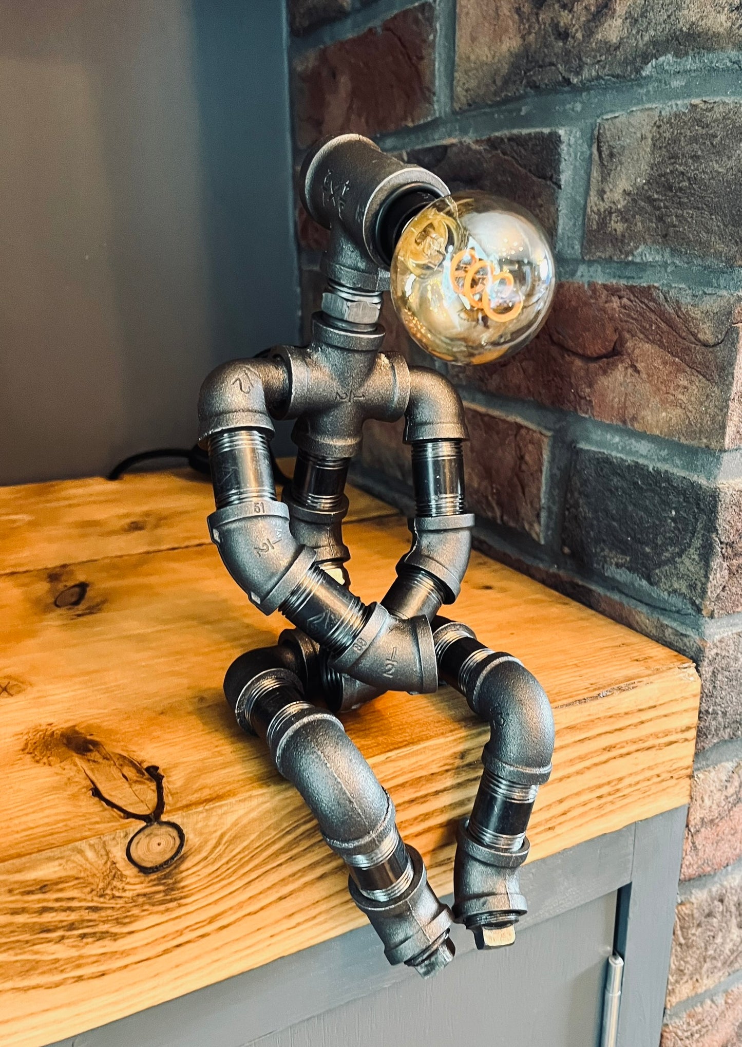 The Pensive Man Industrial Iron Pipe Lamp & Vintage Bulb