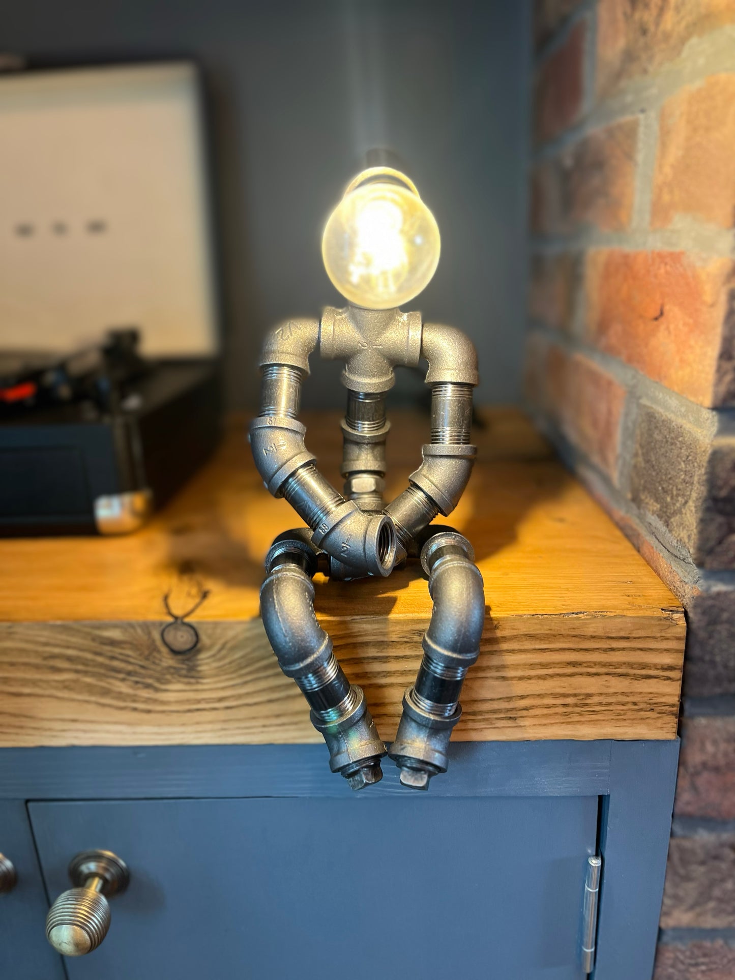 The Pensive Man Industrial Iron Pipe Lamp & Modern White Bulb