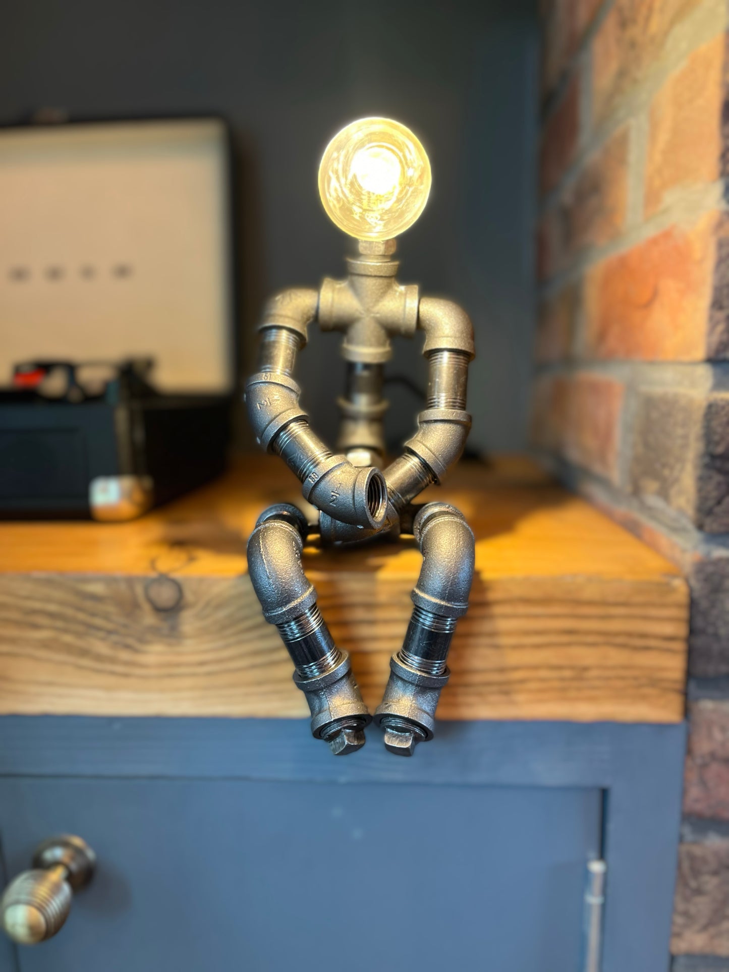 The Pensive Man Industrial Iron Pipe Lamp & Modern White Bulb