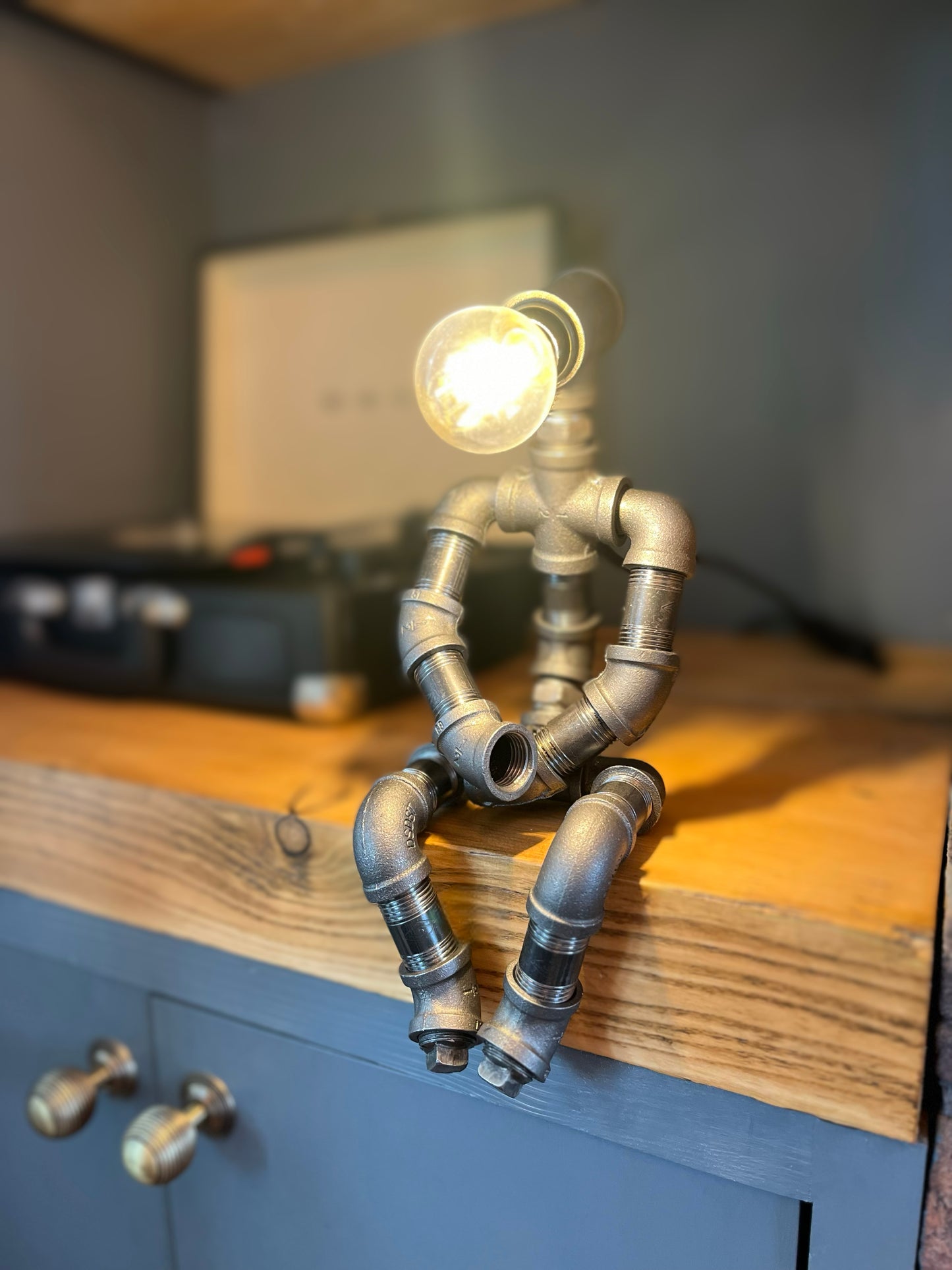 The Pensive Man Industrial Iron Pipe Lamp & Modern White Bulb