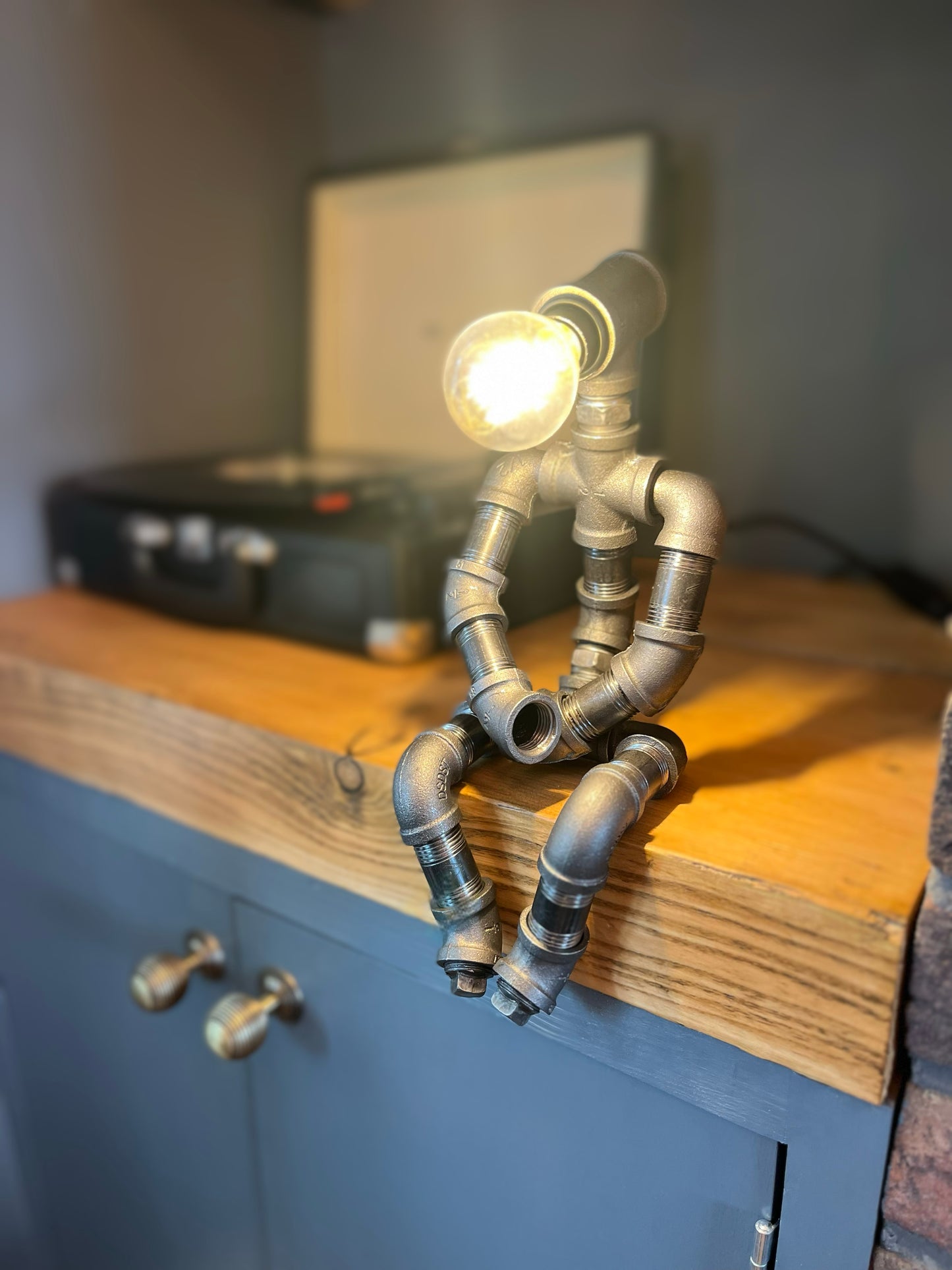 The Pensive Man Industrial Iron Pipe Lamp & Modern White Bulb