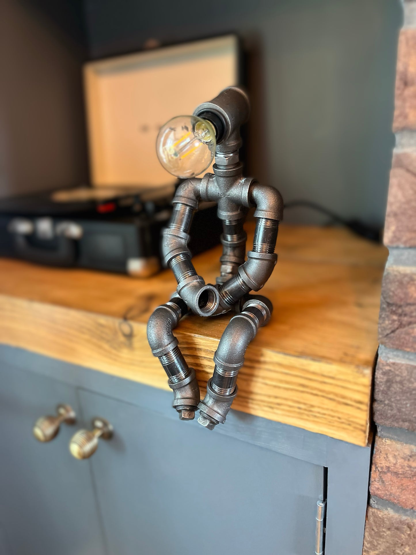 The Pensive Man Industrial Iron Pipe Lamp & Modern White Bulb