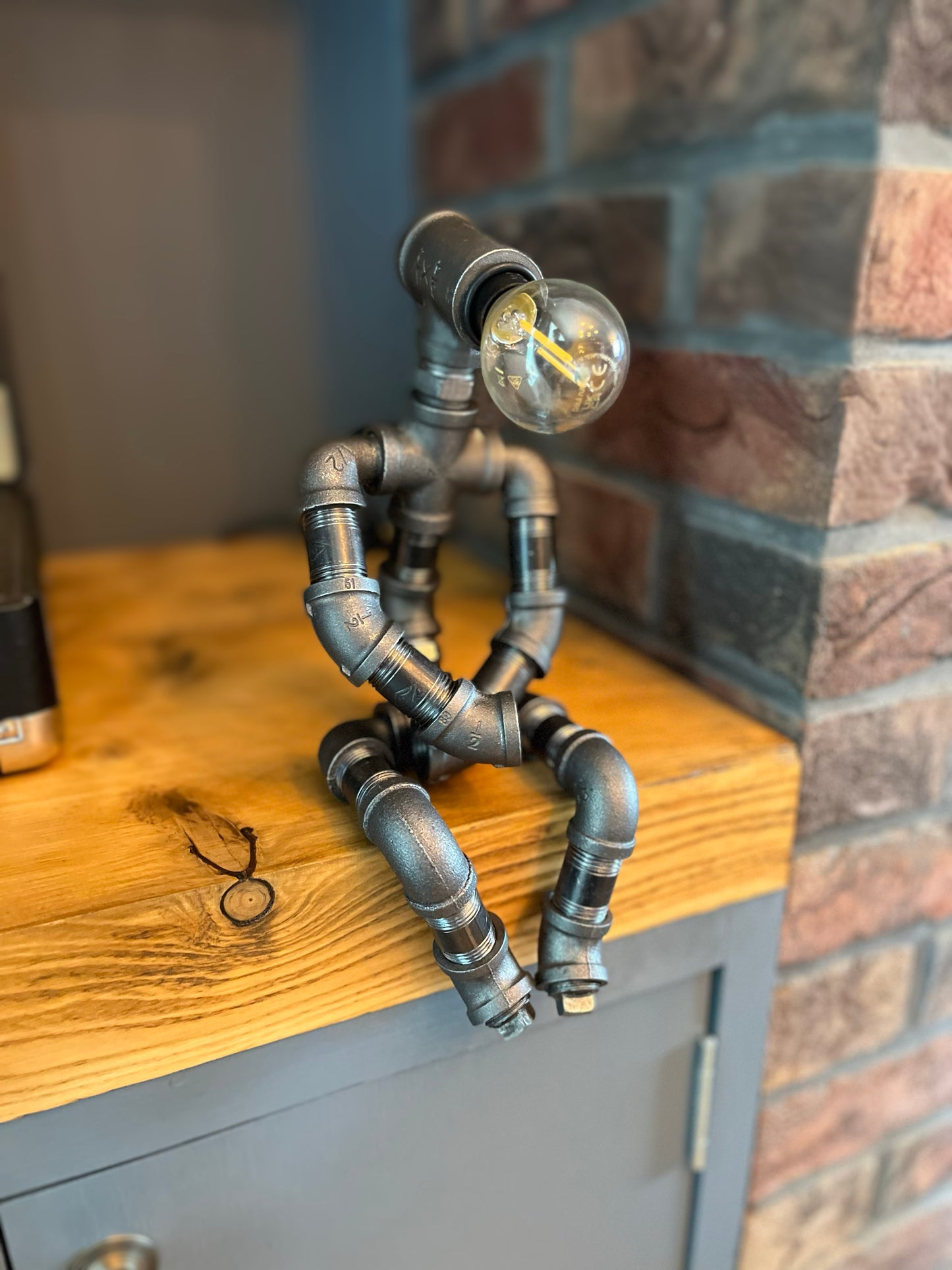 The Pensive Man Industrial Iron Pipe Lamp & Modern White Bulb