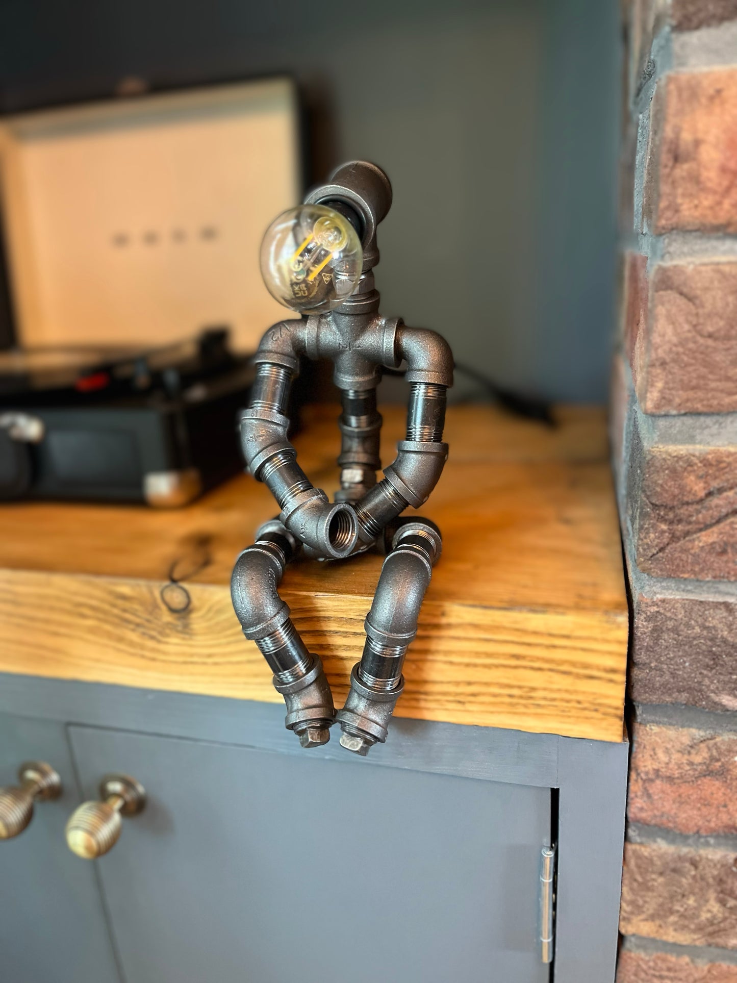 The Pensive Man Industrial Iron Pipe Lamp & Modern White Bulb