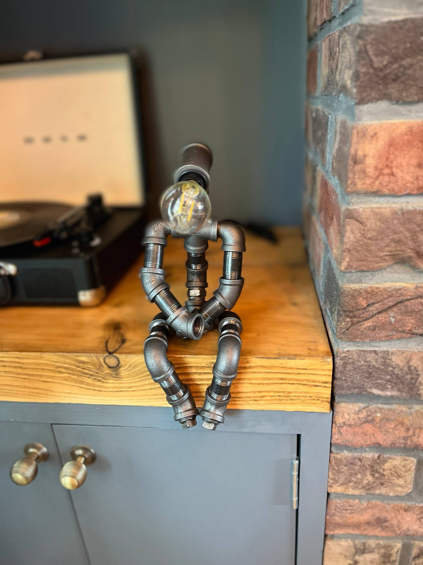 The Pensive Man Industrial Iron Pipe Lamp & Modern White Bulb