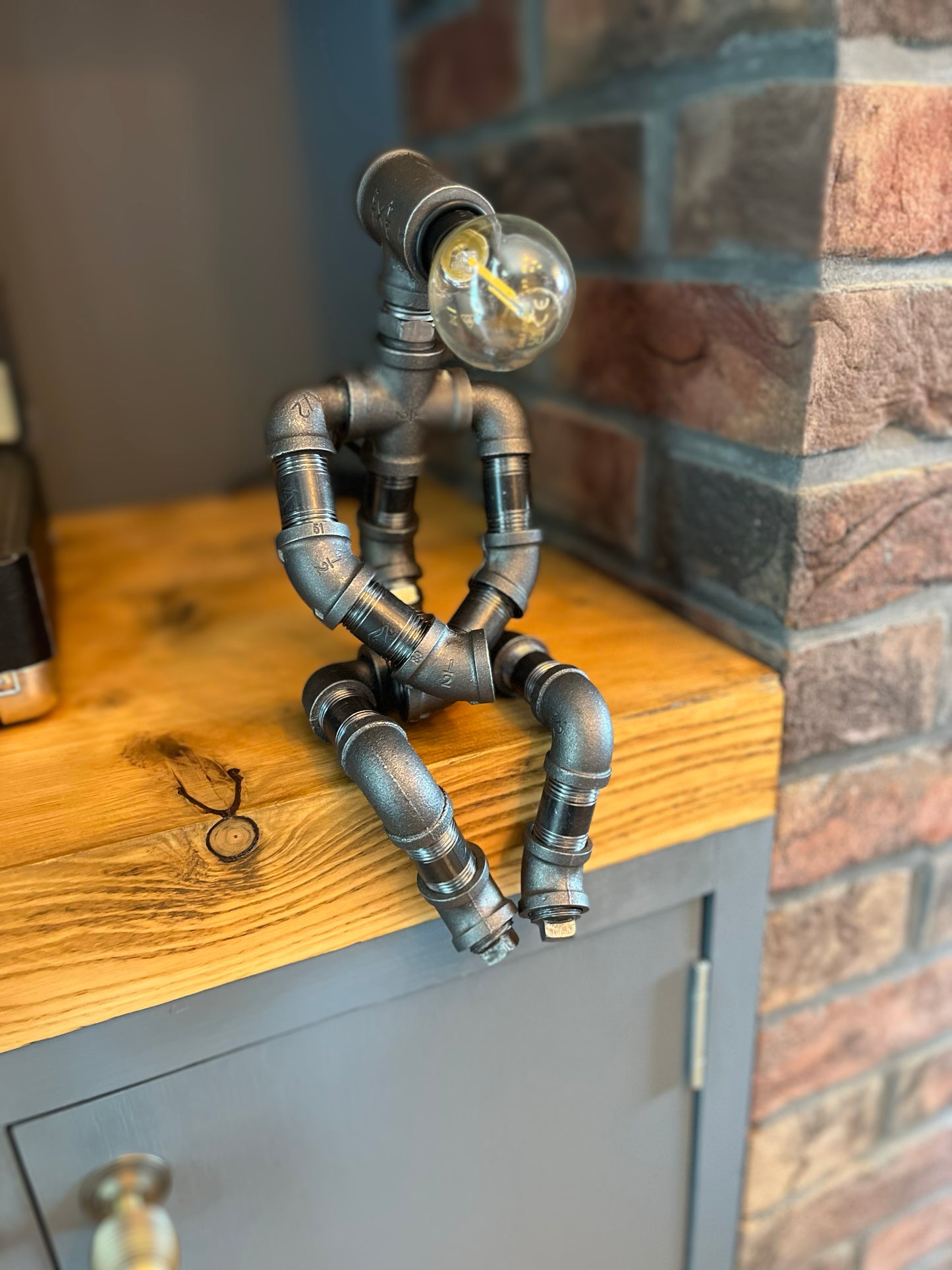 The Pensive Man Industrial Iron Pipe Lamp & Modern White Bulb