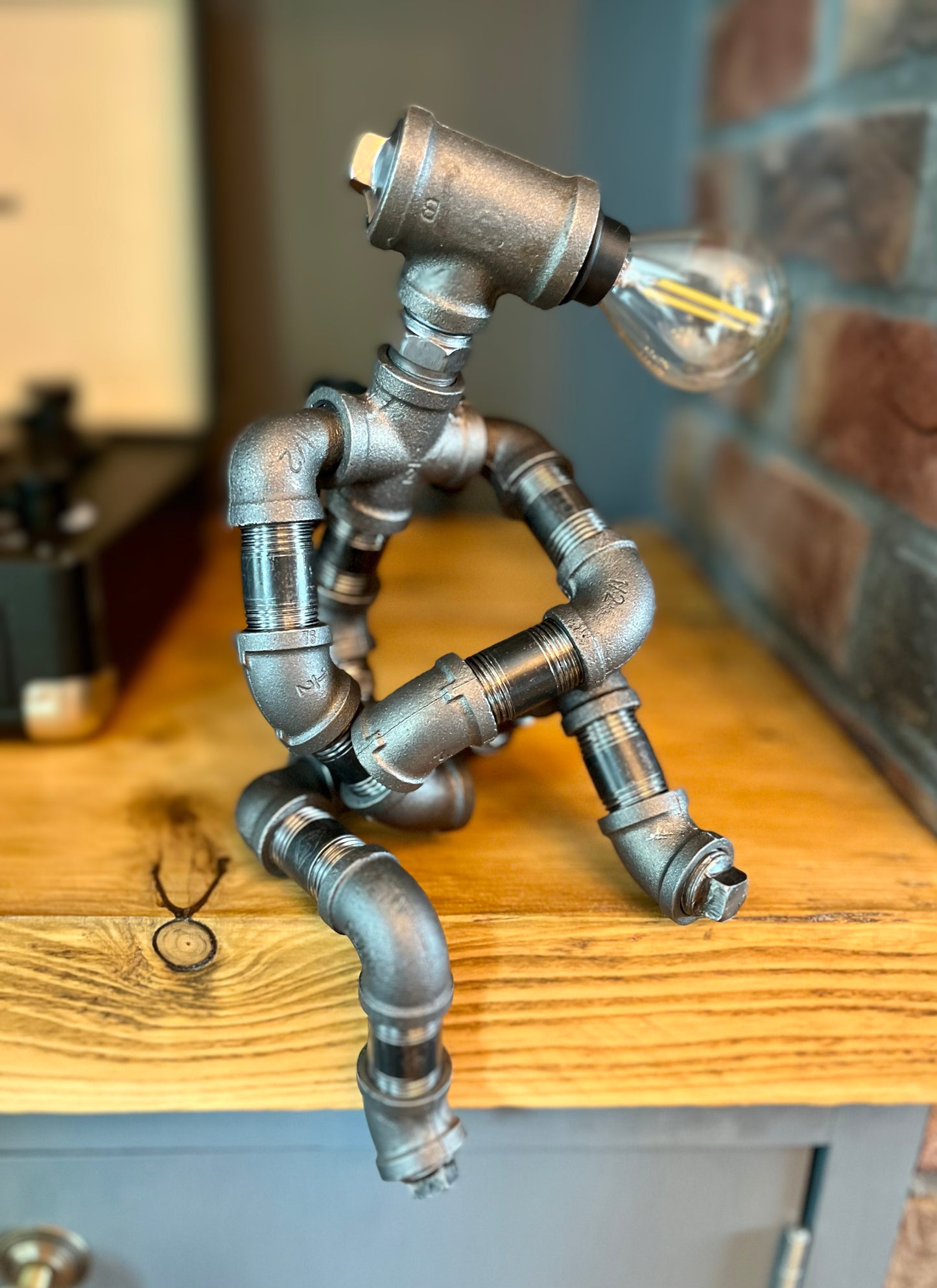 The Companion Industrial Iron Pipe Person Robot Lamp & Modern White Bulb