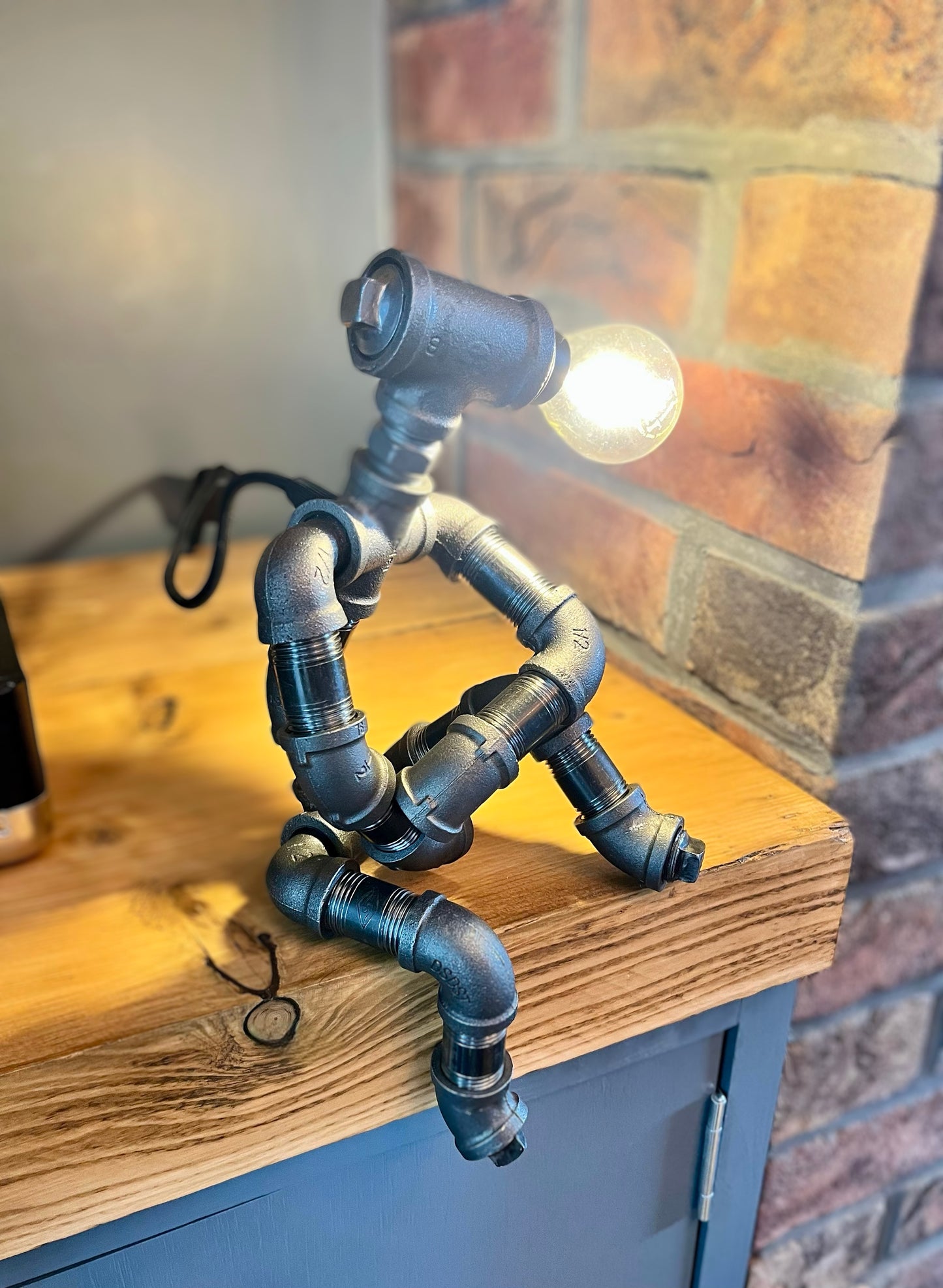 The Companion Industrial Iron Pipe Person Robot Lamp & Modern White Bulb
