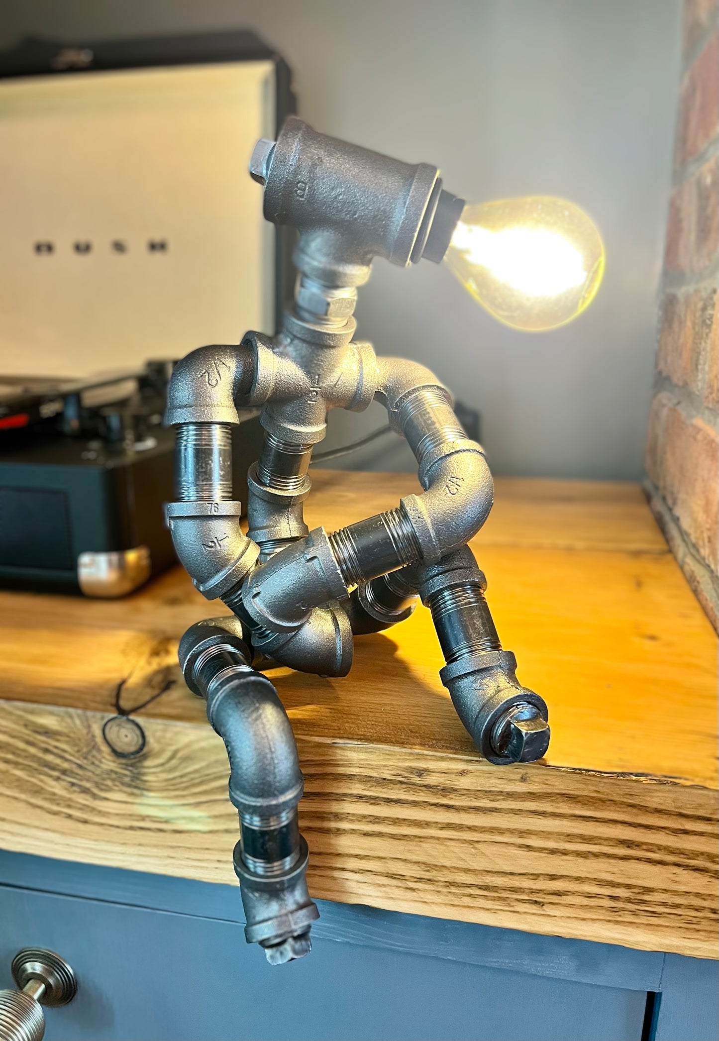 The Companion Industrial Iron Pipe Person Robot Lamp & Modern White Bulb