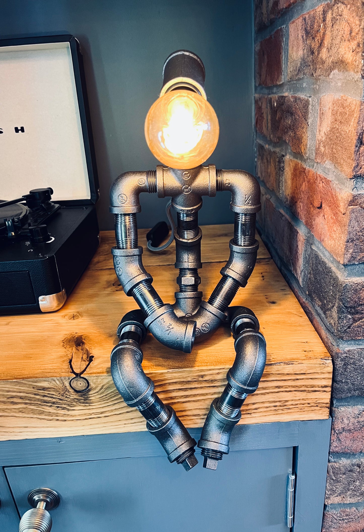 The Pensive Man Industrial Iron Pipe Man Robot Lamp & Vintage Bulb