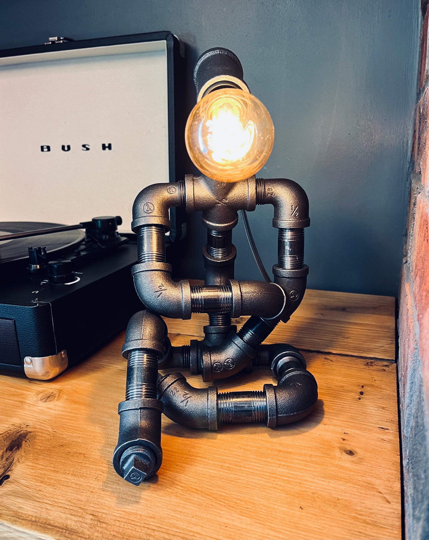 The Thinking Man Industrial Iron Pipe Person Robot Lamp & Vintage Bulb