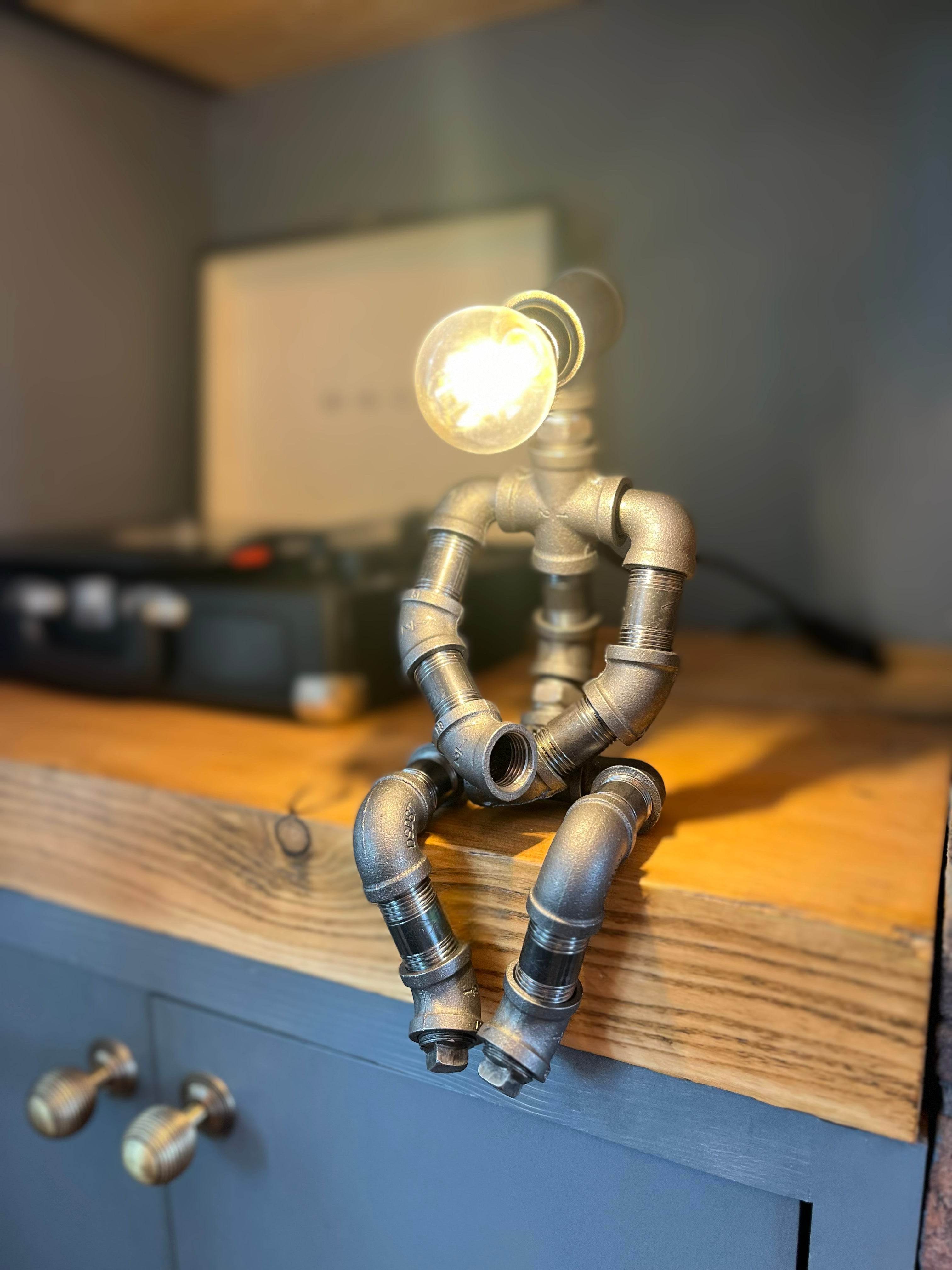 The Pensive Man Industrial Iron Pipe Lamp & Modern White Bulb