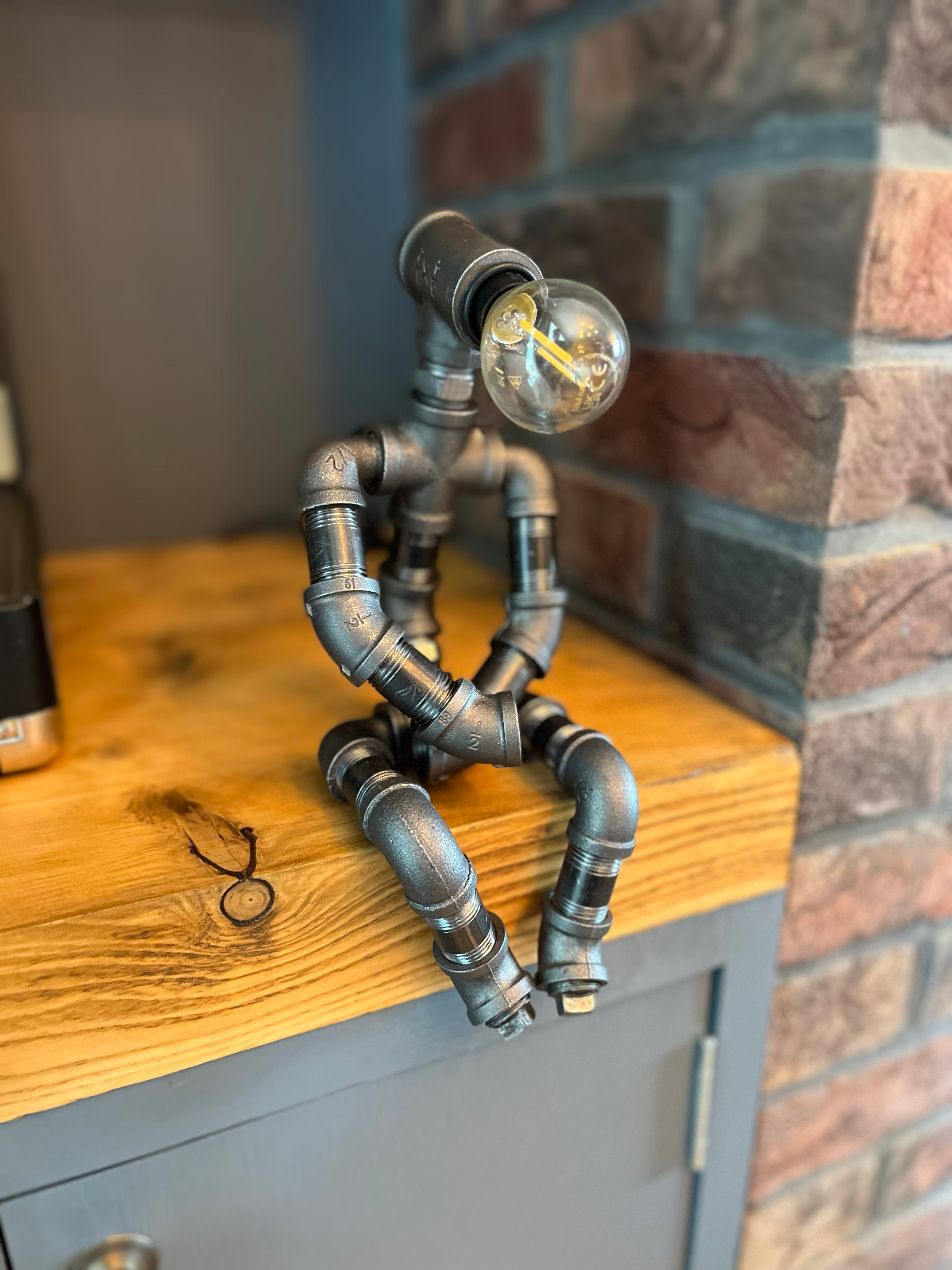 The Pensive Man Industrial Iron Pipe Lamp & Modern White Bulb