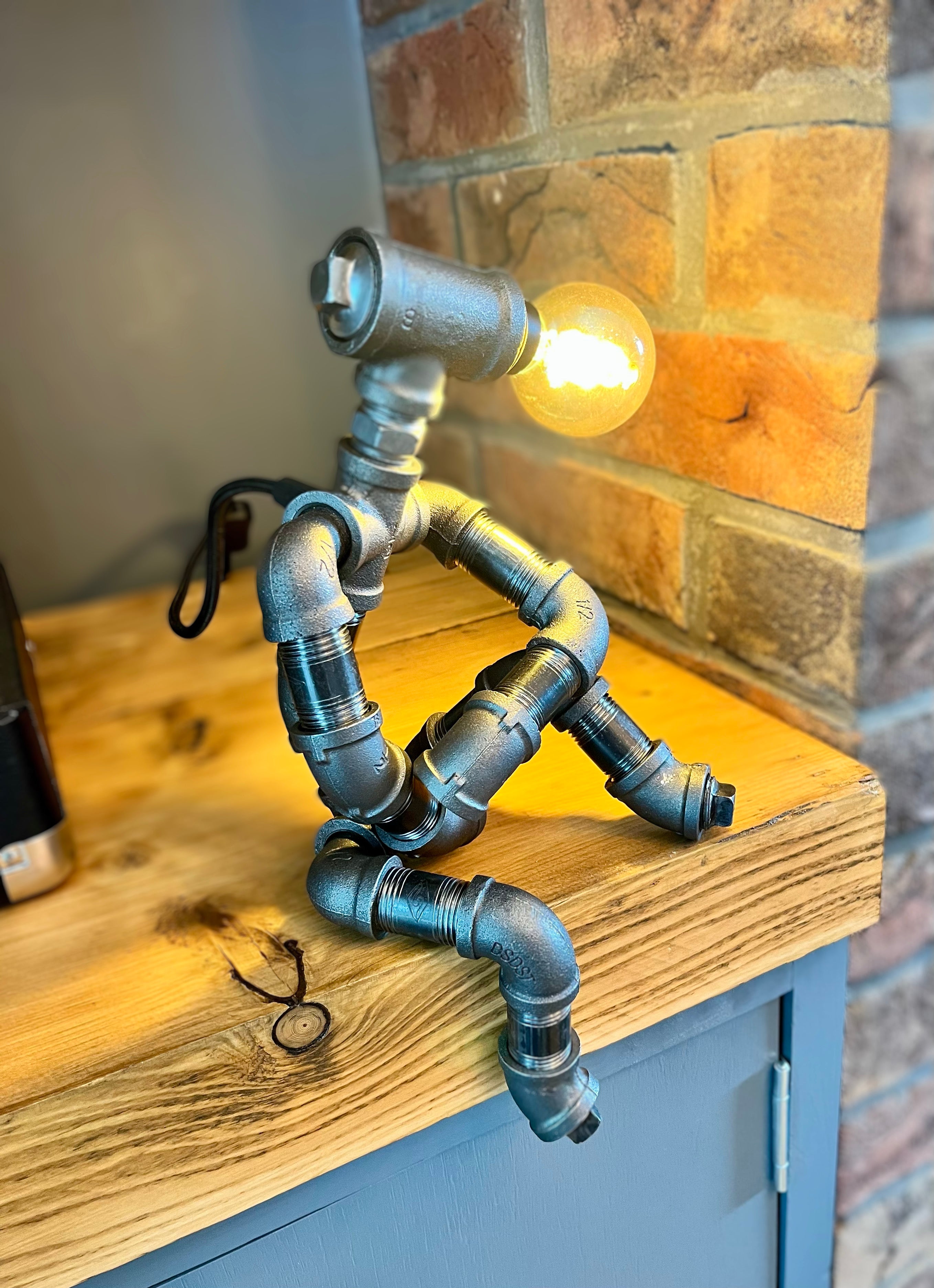 The Companion Industrial Iron Pipe Person Robot Lamp & Vintage Bulb