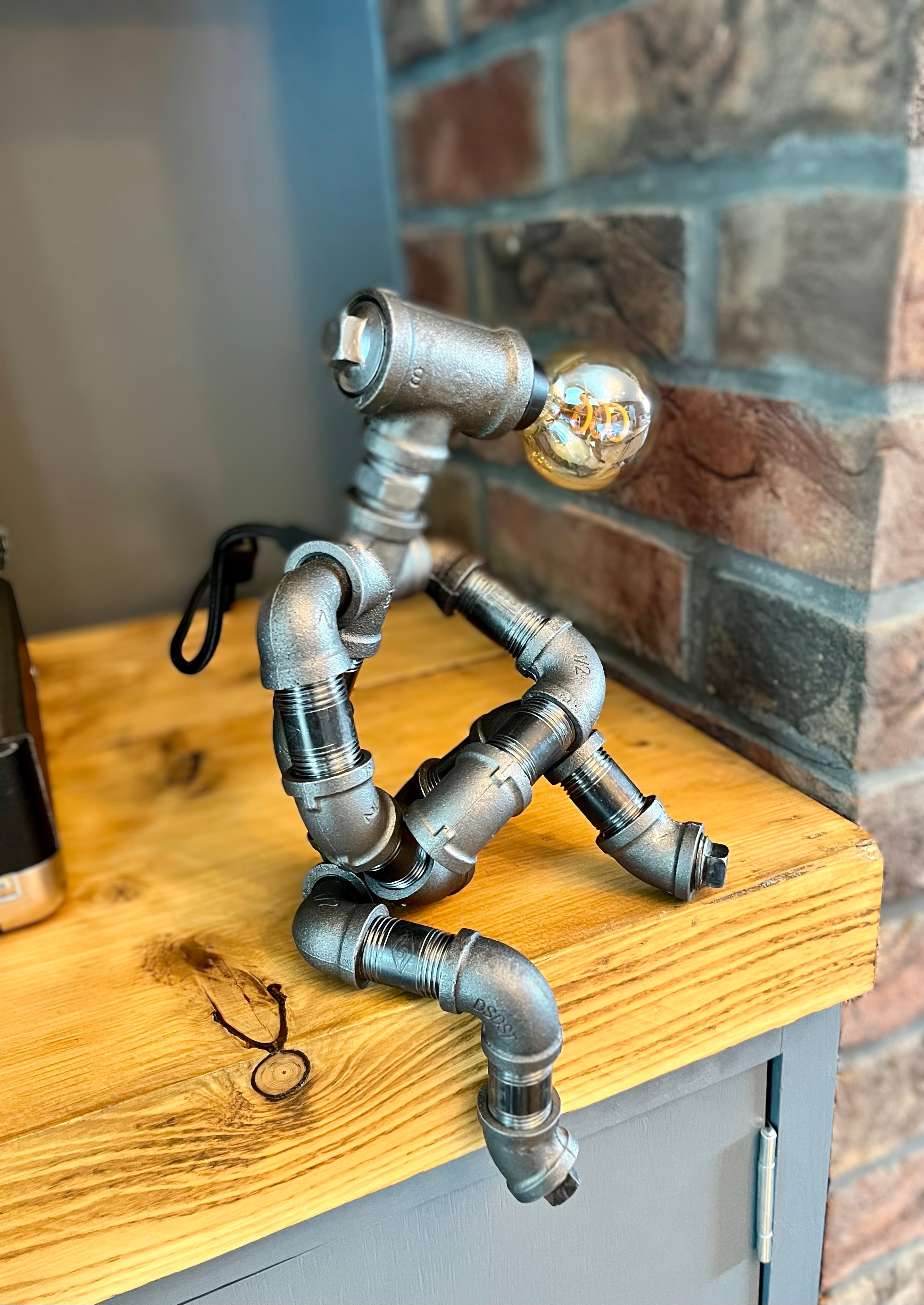 The Companion Industrial Iron Pipe Person Robot Lamp & Vintage Bulb