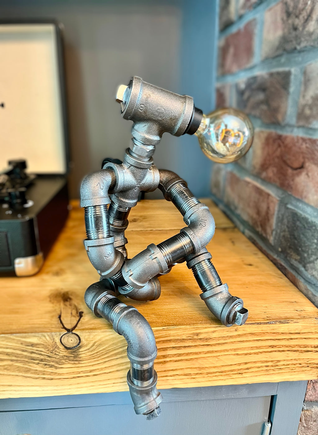 The Companion Industrial Iron Pipe Person Robot Lamp & Vintage Bulb