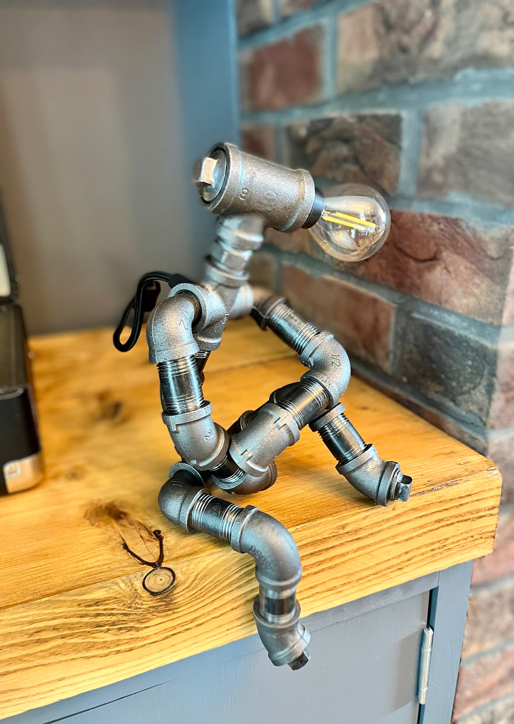 The Companion Industrial Iron Pipe Person Robot Lamp & Modern White Bulb