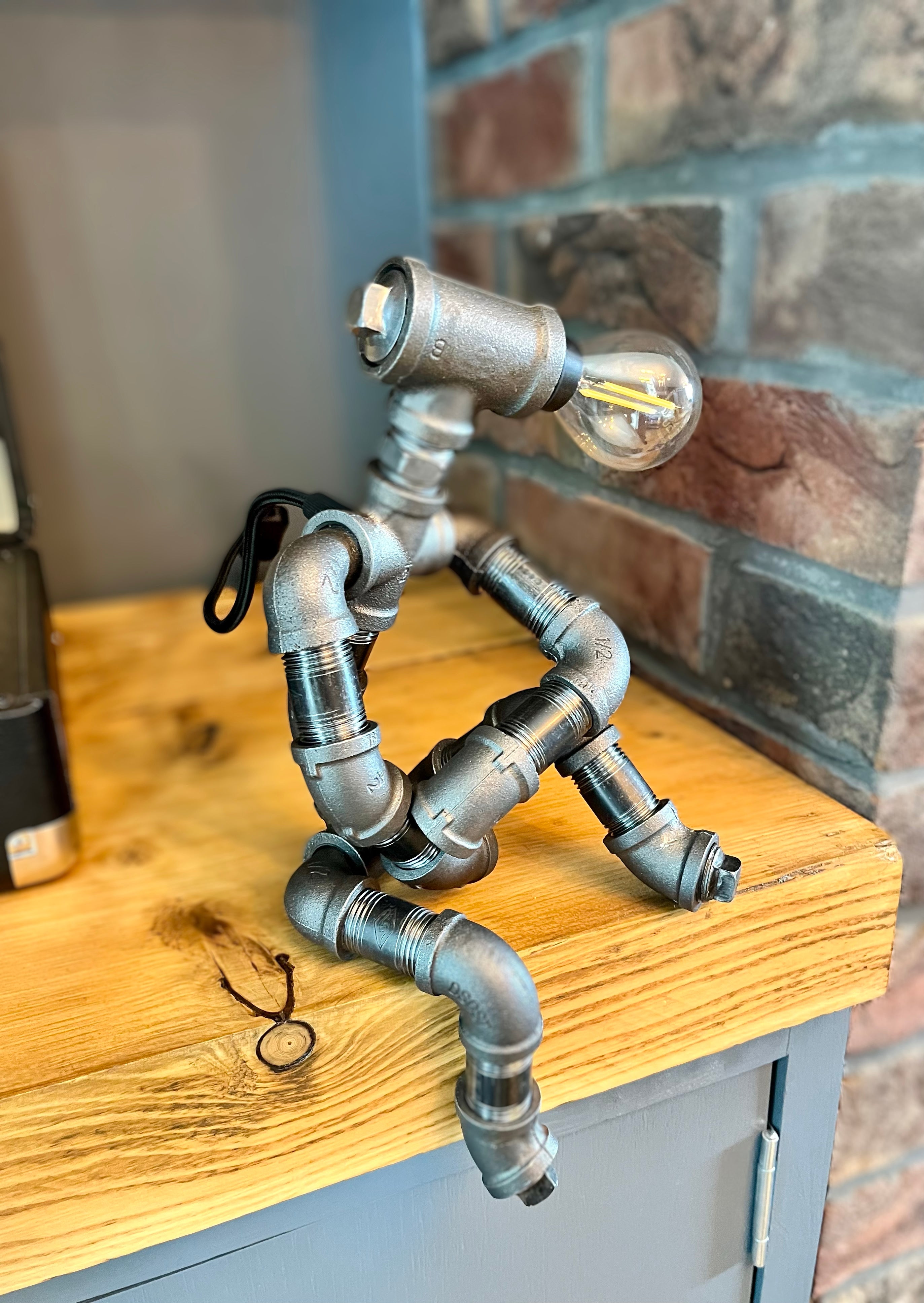 The Companion Industrial Iron Pipe Person Robot Lamp & Modern White Bulb