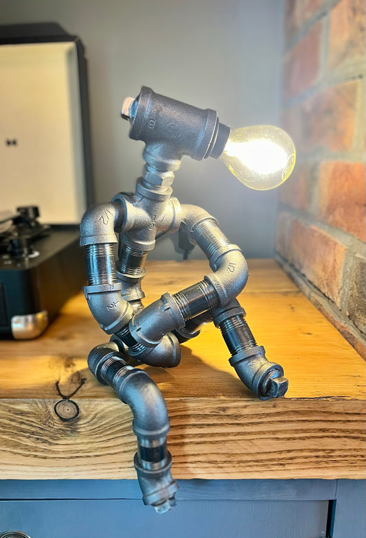 The Companion Industrial Iron Pipe Person Robot Lamp & Modern White Bulb