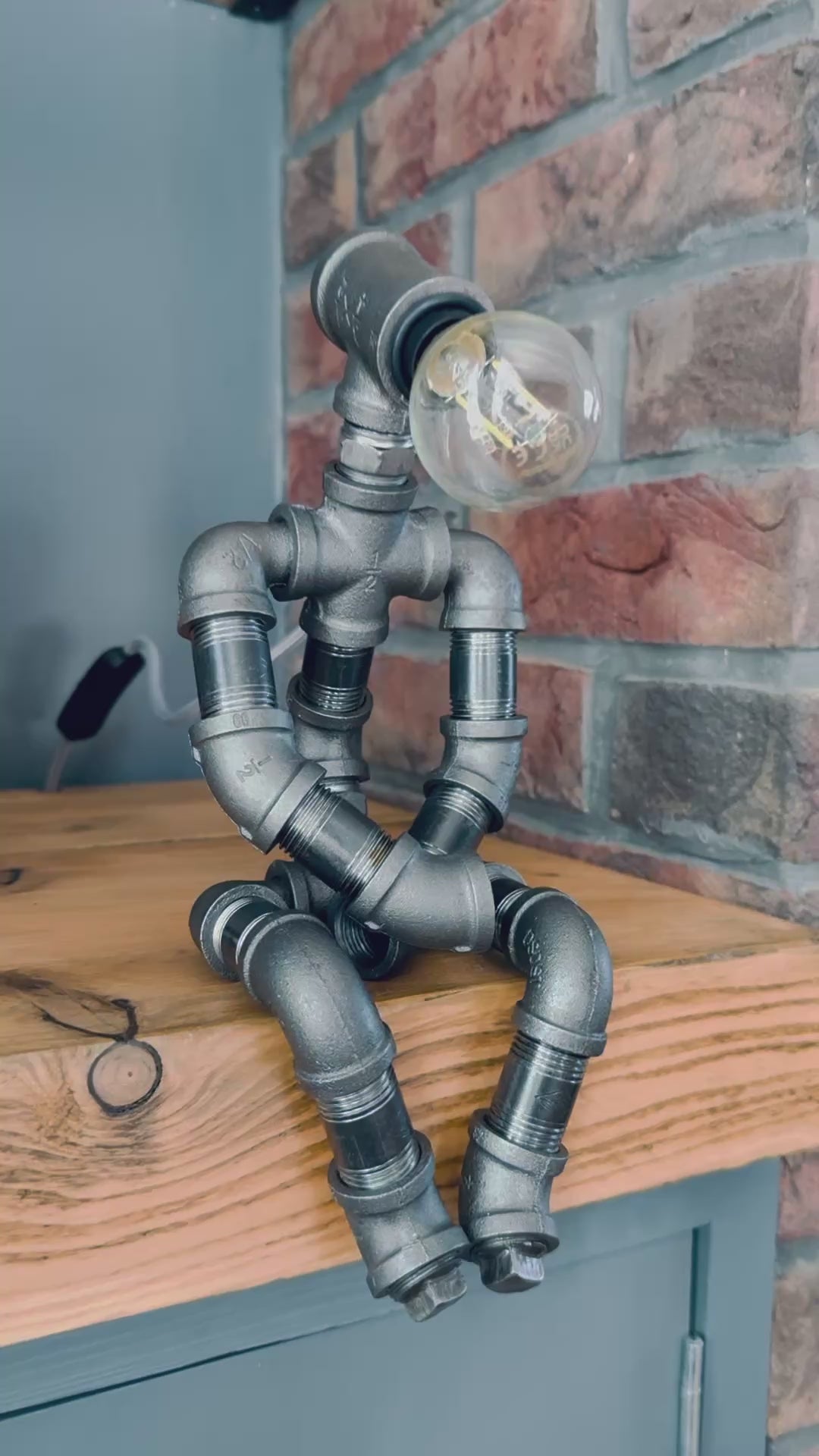 The Pensive Man Industrial Iron Pipe Lamp & Modern White Bulb
